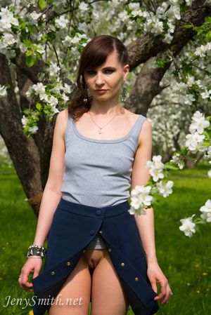 Jeny Smith wears an open skirt without panties to the apple tree